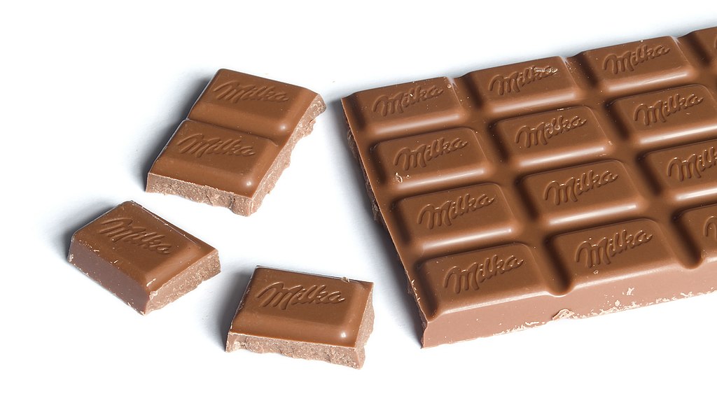 Milka chocolate bar (100g) with chunks broken off